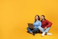 Happy millennial couple using laptop and looking at copy space Royalty Free Stock Photo