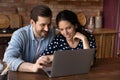 Happy millennial family couple surfing internet on laptop Royalty Free Stock Photo