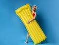 Happy millennial girl holding inflatable mattress, ready to chill out in pool Royalty Free Stock Photo