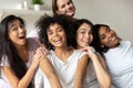 Happy millennial girls smile for picture at hen party