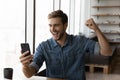 Happy millennial man in casual excited with good news Royalty Free Stock Photo