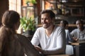 Happy couple enjoying date in cafe drinking coffee Royalty Free Stock Photo