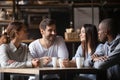 Diverse young people meeting in cafe drinking coffee Royalty Free Stock Photo