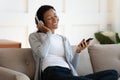 Happy black woman listening music on headphones Royalty Free Stock Photo