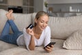 Happy millennial woman buying on internet on pad Royalty Free Stock Photo