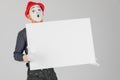 happy MIME artist holding a blank white Board, on a white background.