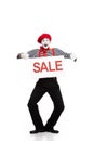 happy mime holding sale signboard and showing thumbs up Royalty Free Stock Photo