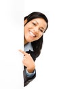 Happy mixed race business woman pointing at empty copy space iso