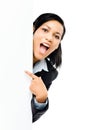 Happy mixed race business woman pointing at empty copy space iso Royalty Free Stock Photo