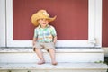 Happy Mixed Race Chinese and Caucasian Boy Wearing Cowboy Hat