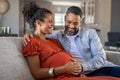 Happy mixed race couple expecting baby Royalty Free Stock Photo