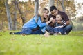 Happy Mixed Race Ethnic Family Playing with Bubbles In The Park Royalty Free Stock Photo