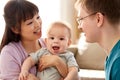 Happy mixed-race family with baby son at home Royalty Free Stock Photo