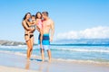 Happy Mixed Race Family on the Beach Royalty Free Stock Photo