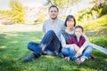 Mixed Race Family Having Fun Outside on the Grass Royalty Free Stock Photo