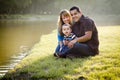 Happy Mixed Race Family Posing for A Portrait