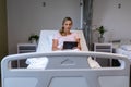 Happy mixed race mother and daughter sitting on the sofa,having fun and using laptop Royalty Free Stock Photo