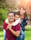 Happy Mixed Race Young Family Portrait At The Park Royalty Free Stock Photo