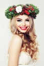 Happy Model Woman with Christmas Wreath. Beautiful Woman