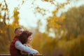 happy modern couple in park sitting on bench Royalty Free Stock Photo