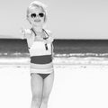 Happy modern girl on beach showing thumbs up Royalty Free Stock Photo