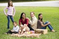 Happy modern multicultural family enjoying picnic Royalty Free Stock Photo