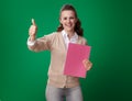 Happy modern student woman with pink notebook showing thumbs up Royalty Free Stock Photo