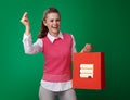 Student woman with shopping bag with books fingers snapping Royalty Free Stock Photo