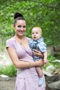 Happy mom and baby boy hugging and laughing. The concept of childhood and family. Royalty Free Stock Photo