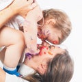 Happy mom and baby playing with painted face by paint Royalty Free Stock Photo