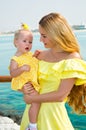 Happy mom and child girl hugging. The concept of childhood and family. Beautiful Mother and her baby outdoor Royalty Free Stock Photo