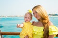 Happy mom and child girl hugging. The concept of childhood and family. Beautiful Mother and her baby outdoor Royalty Free Stock Photo