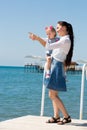 Happy mom and child girl hugging on nature The concept of childhood and family. Beautiful Mother and her baby Royalty Free Stock Photo