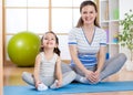 Happy mom and child spends time in the gym Royalty Free Stock Photo