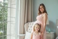 Happy mom and daughter. Pregnant woman and little child girl Royalty Free Stock Photo