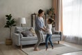 Happy mom and excited active daughter girl dancing to music Royalty Free Stock Photo