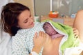 Happy mom, having her baby skin to skin first seconds after birth Royalty Free Stock Photo