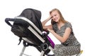 Happy mom with her baby in pram Royalty Free Stock Photo