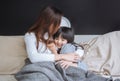 Happy mom and her daughter girl playing and hugging in bedroom. Royalty Free Stock Photo