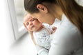 Happy mom holds the baby in her arms. happy motherhood concept Royalty Free Stock Photo