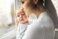 Happy mom holds the baby in her arms. Royalty Free Stock Photo