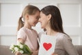 Happy mom and kid daughter laughing celebrating mothers day together