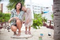 Happy mom and kid enjoying time together at the white beach Royalty Free Stock Photo