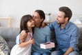 Happy mom kiss cute little daughter thanking for present