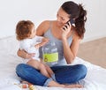 Happy, mom and phone call with baby in home talking on bed with child playing with toys, Smartphone, conversation and