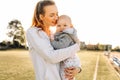 Happy mom plays, hugs and kisses her little son outdoors.Happy women`s day.Family holiday and unity Royalty Free Stock Photo