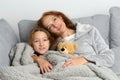 Mom sitting on couch with daughter