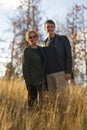 Happy mom and son smiling outdoors in sun