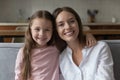 Happy mom and sweet little daughter girl home head shot Royalty Free Stock Photo