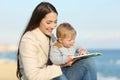 Mom teaching and baby learning reading a book